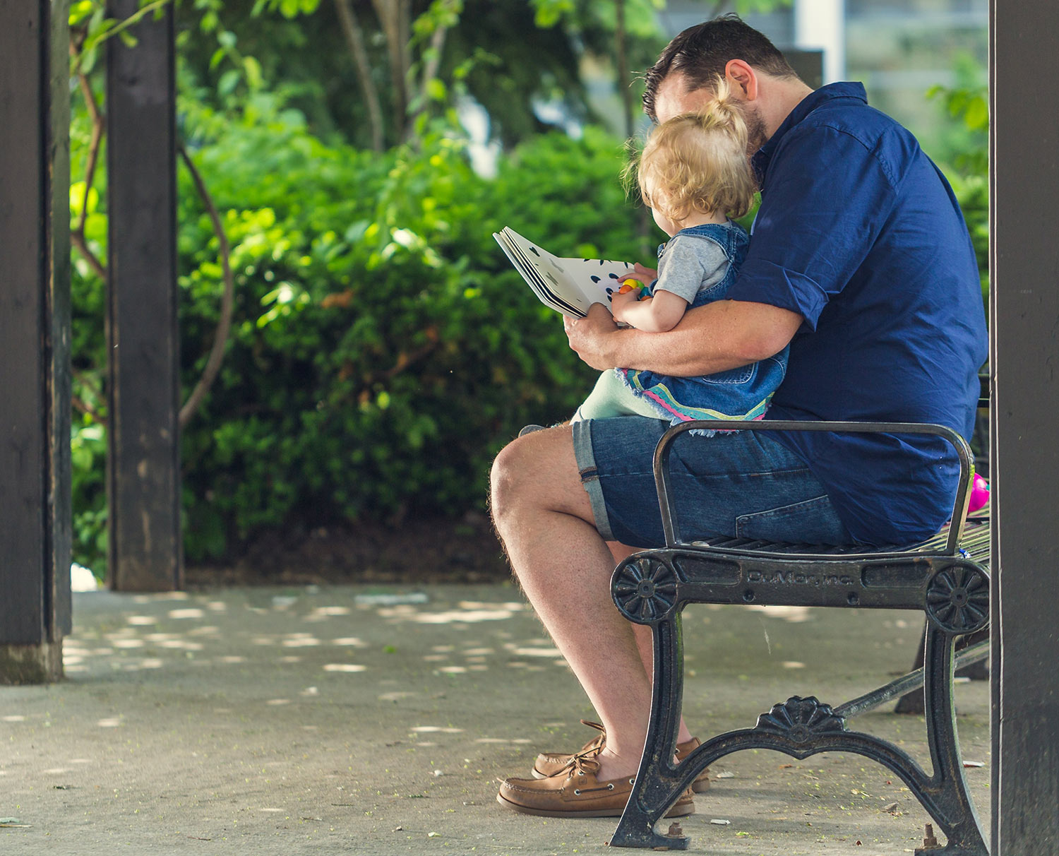 Father reading to their child.